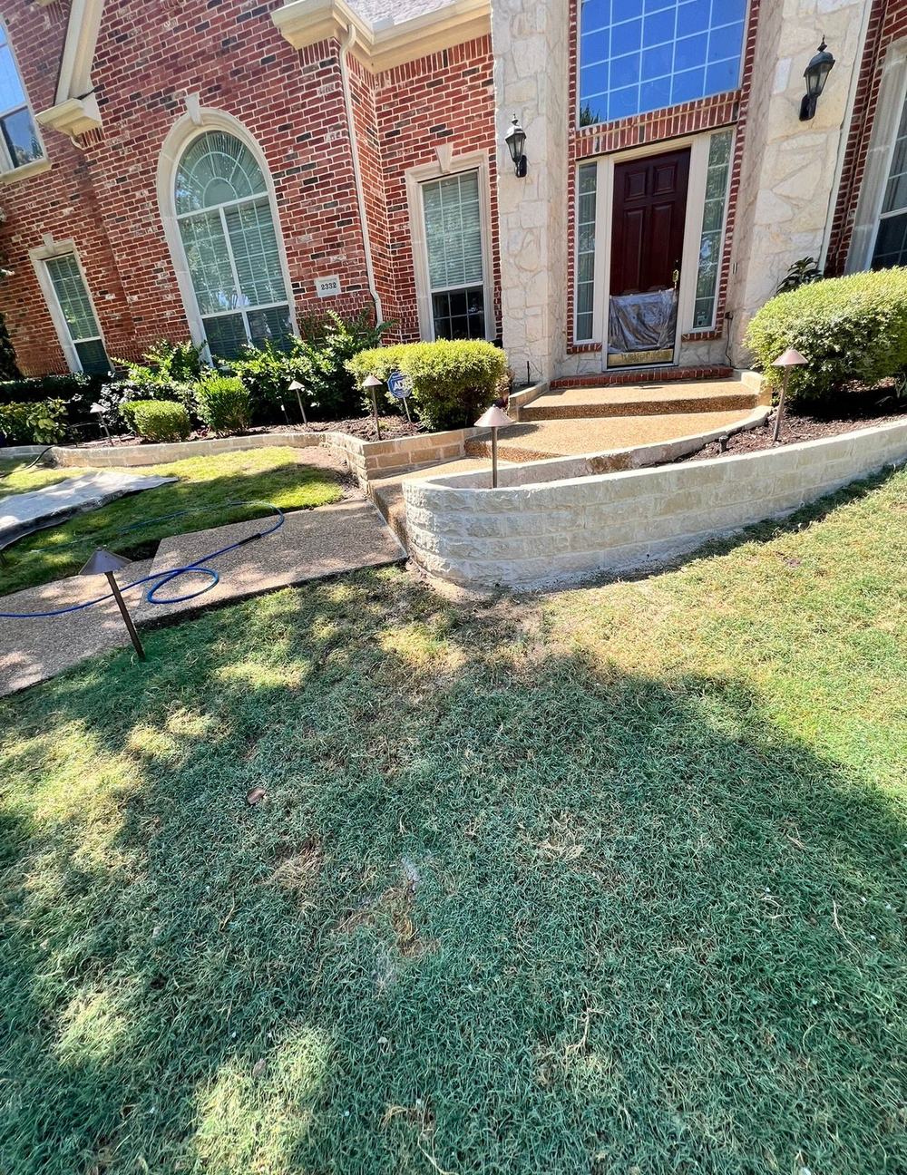 Stone retaining wall at a front entry